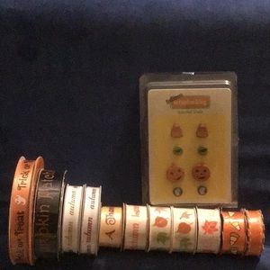 11 spools Fall/ Halloween themed ribbon and a set of brads
